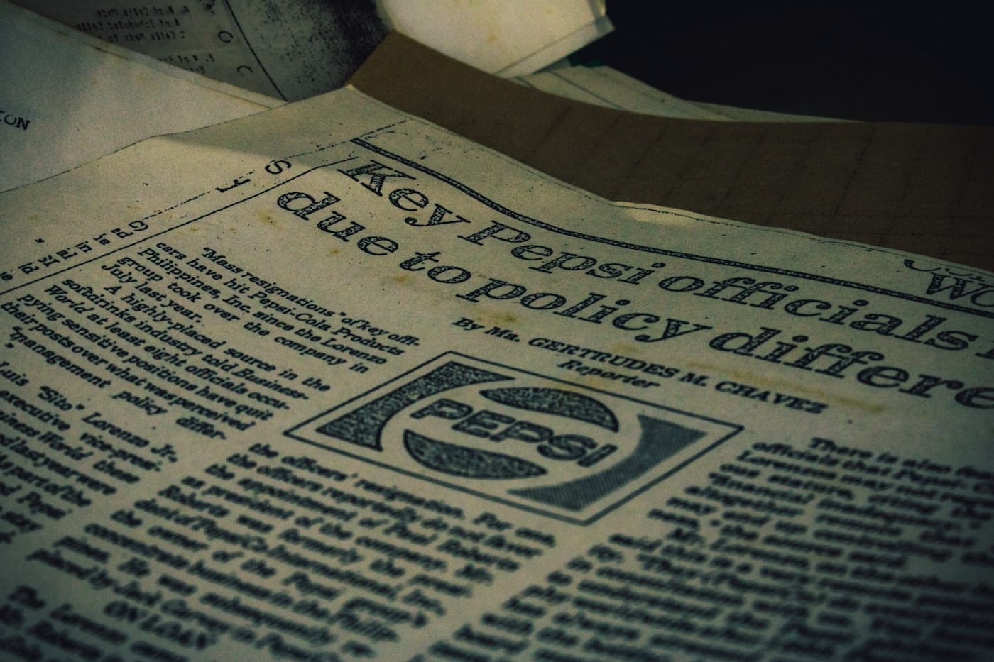 a pile of newspapers sitting on top of a table